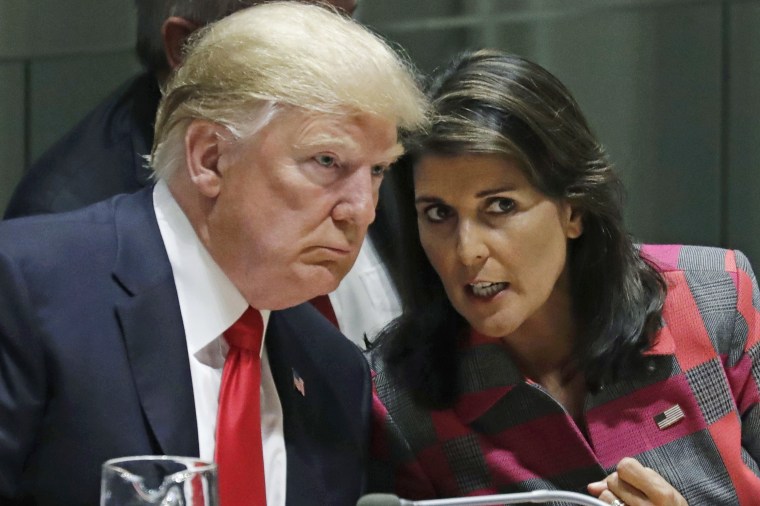President Donald Trump talks to Nikki Haley, the U.S. Ambassador to the United Nations, in 2018.