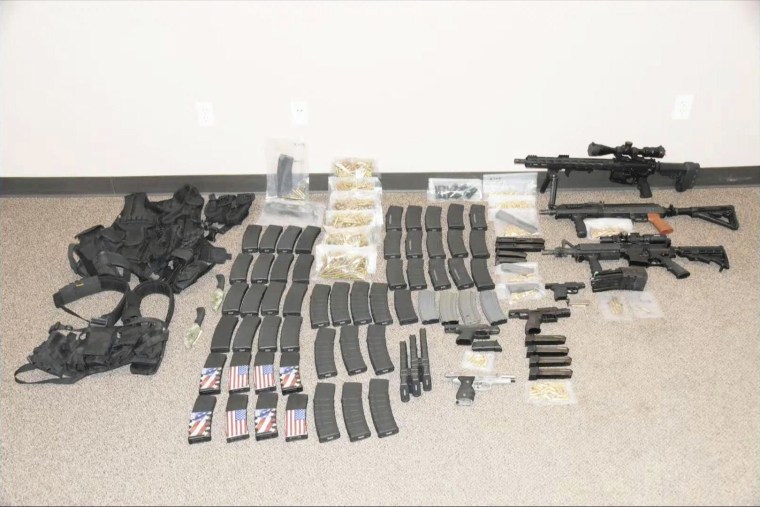 This photo released by the North Dakota Bureau of Criminal Investigation on Wednesday, July 19, 2023, shows the cache of weapons and ammunition that authorities recovered from the car of a man who opened fire on Fargo, N.D., police officers on Friday, July 14. One officer, Jake Wallin, was killed and two others were injured before a fourth officer shot and killed 37-year-old Mohamad Barakat.