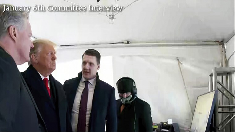 A photo featured by the House Jan. 6 committee of then-President Donald Trump talking to his chief of staff, Mark Meadows, and aide William Russell before Trump's speech on the morning of Jan. 6, 2021.