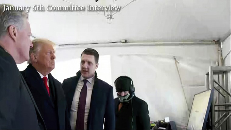 A photo featured by the House Jan. 6 committee of former President Donald Trump talking to his chief of staff, Mark Meadows, and aide William Russell before Trump's speech on the morning of Jan. 6, 2021.