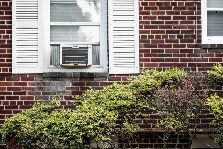 Image: A window air conditioner unit on the side of an apartment building in Arlington, Va., July 10, 2023.