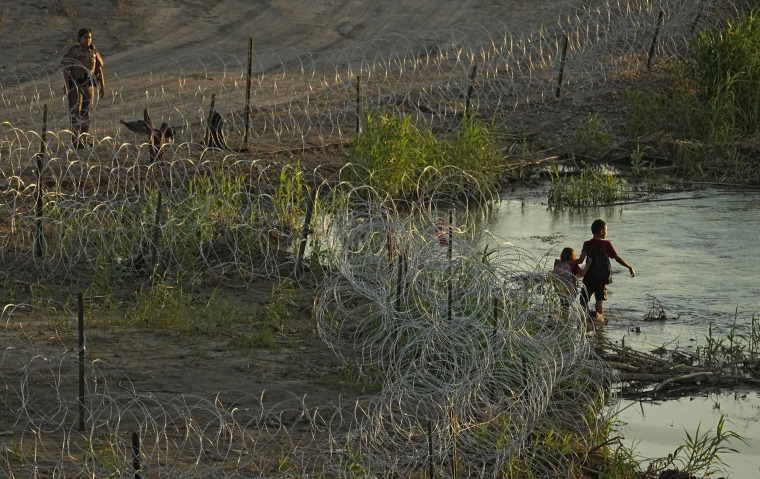 Migrants try to cross the Rio Grande into Eagle Pass, Texas, on July 6, 2023. 
