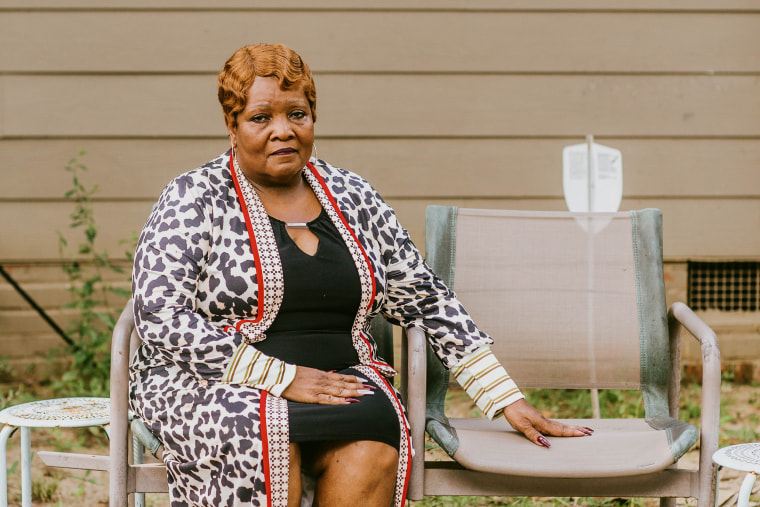 Bettersten Wade sits on double chaired patio furniture in front her home, where her and her brother would sit and talk from time to time in Jackson, Miss.