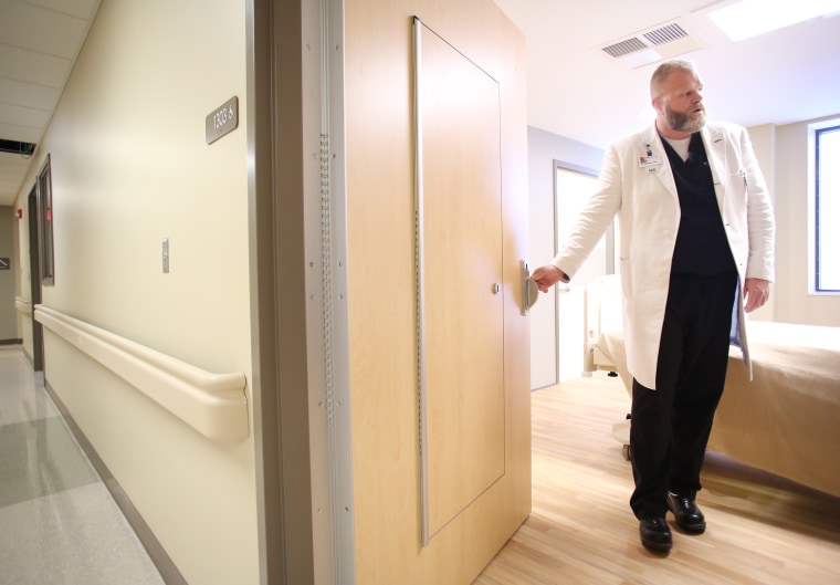 Dr. Brian Hyatt describes the additional access safety door in one of the medical psychiatric rooms at Northwest Medical Center-Springdale in 2018.