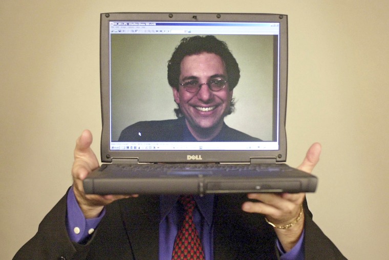 Computer hacker turned author Kevin Mitnick poses in 2002 in Las Vegas. 