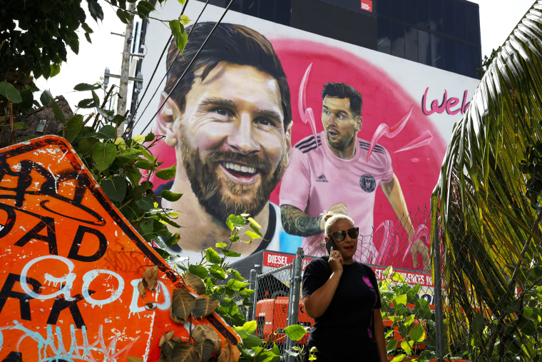 A person walks pass a giant mural of international soccer star Lionel Messi made by Maximiliano Bagnasco, an Argentine artist, on July 20, 2023 in Wynwood, Miami’s art district, Florida.