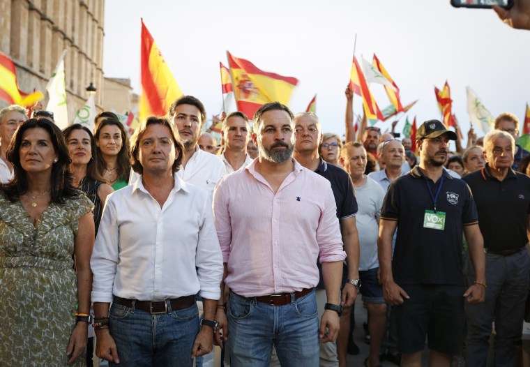 Vox party leader Santiago Abascal, center, listens to the national anthem during a campaign event in Palma de Mallorca on July 14, 2023.