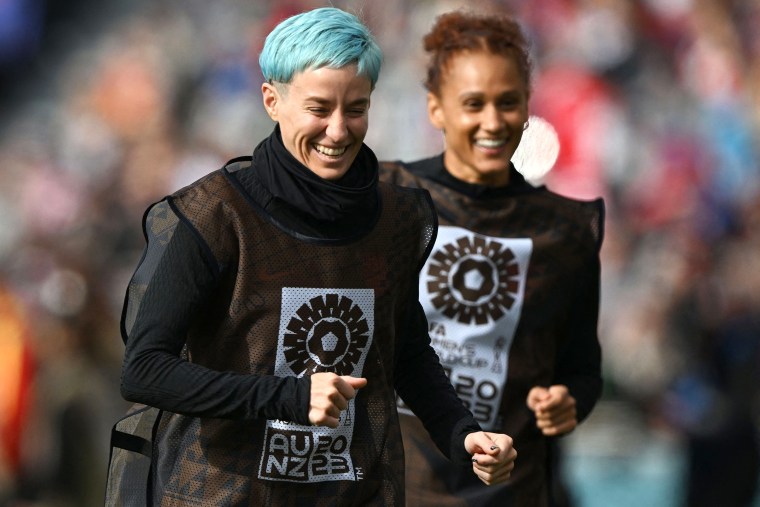 USA's forward #15 Megan Rapinoe and USA's' forward #06 Lynn Williams warm up during the Australia and New Zealand 2023 Women's World Cup Group E football match between the United States and Vietnam at Eden Park in Auckland on July 22, 2023.
