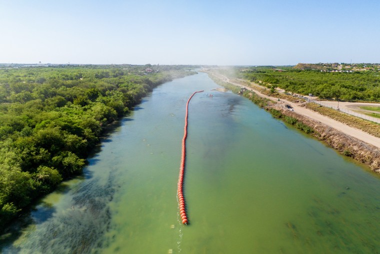 Buoy barriers are installed in the middle of the Rio Grande river in Eagle Pass, Texas,