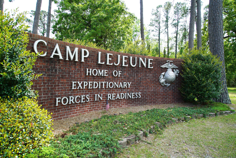 FILE - Signage stands on the main gate to Camp Lejeune Marine Base outside Jacksonville, N.C., Friday, April 29, 2022. Three men who were found dead over the weekend at an eastern North Carolina gas station have been identified as Marine lance corporals stationed nearby at Camp Lejeune, the U.S. Marine Corps said Tuesday, July 25, 2023.