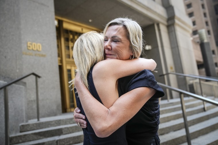 Image: Sexual assault survivors Amy Yoney, right, and Laurie Kanyok, left, embrace after speaking to members of the media during a break in sentencing proceedings for convicted sex offender Robert Hadden outside Federal Court, July 24, 2023, in New York.