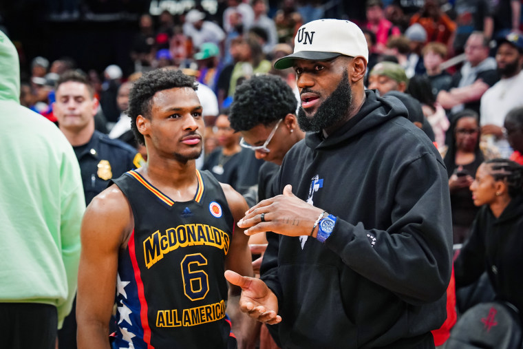 Bronny James talks with his father, Lebron James after the 2023 McDonald's High School Boys All-American Game on March 28.