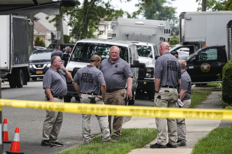 Image: Authorities continue to work at the home of suspect Rex Heuermann in Massapequa Park, N.Y., on July 24, 2023. 