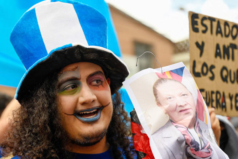 A protester with a photo of Attorney General Consuelo Porras in Guatemala City on Monday, July 24, 2023.