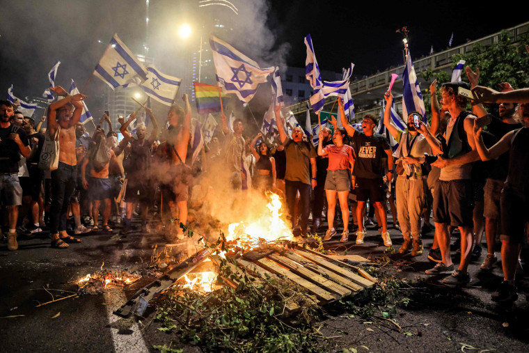 Demonstrators block a highway to protest the Israeli government's judicial reform plan in Tel Aviv on July 24, 2023. 