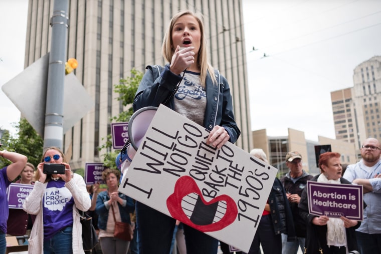 An abortion rights activist chants slogans on a megaphone at a rally in Dayton, Ohio, in 2019. 