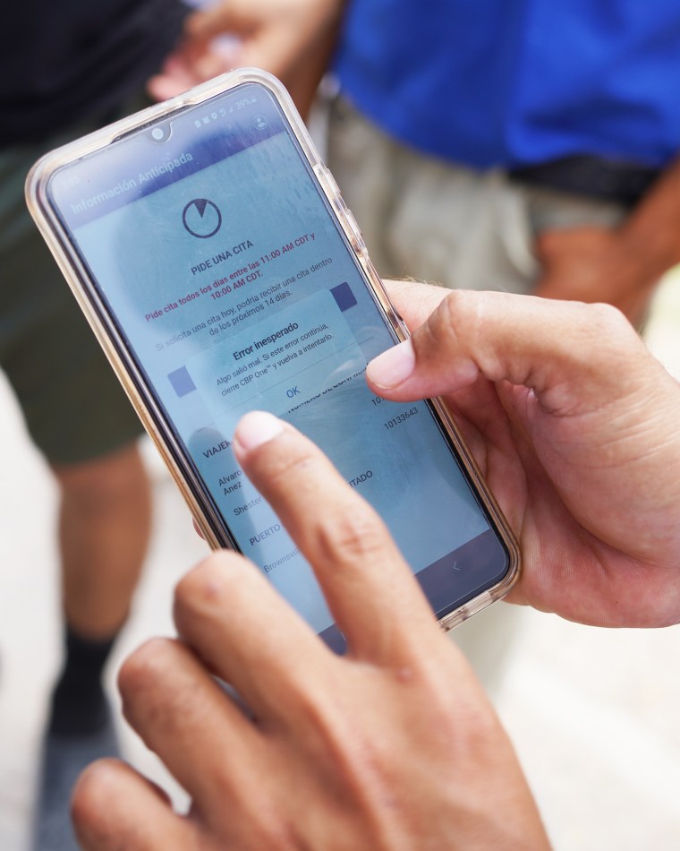 Alvaro Andres Rodriguez Añez, a migrant at a tent camp in Matamoros, Mexico, gets an "error" message while trying to make an appointment on the CBP One mobile app.