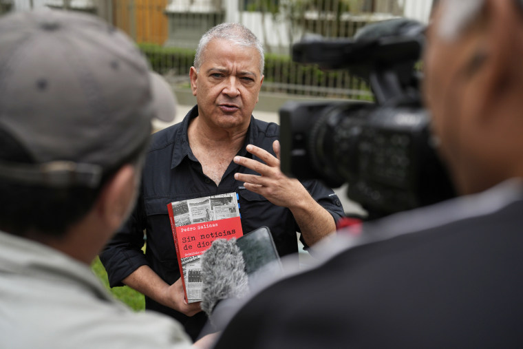 Pedro Salinas speaks with the press outside the Nunciatura Apostolica
