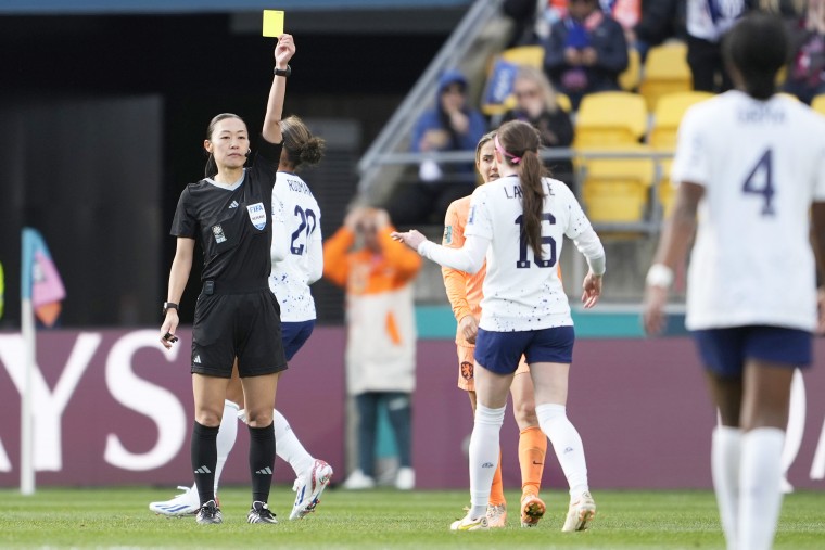 United States' Rose Lavelle, right, is issued a yellow card during the second half of the FIFA Women's World Cup Group E soccer match between the United States and the Netherlands in Wellington, New Zealand, Thursday, July 27, 2023.