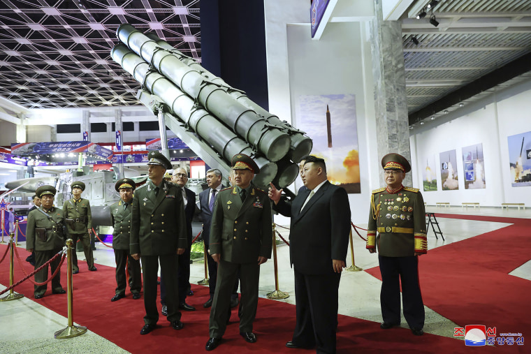 Kim Jong Un, second right, and Sergei Shoigu, third right, visit an arms exhibition in Pyongyang, North Korea