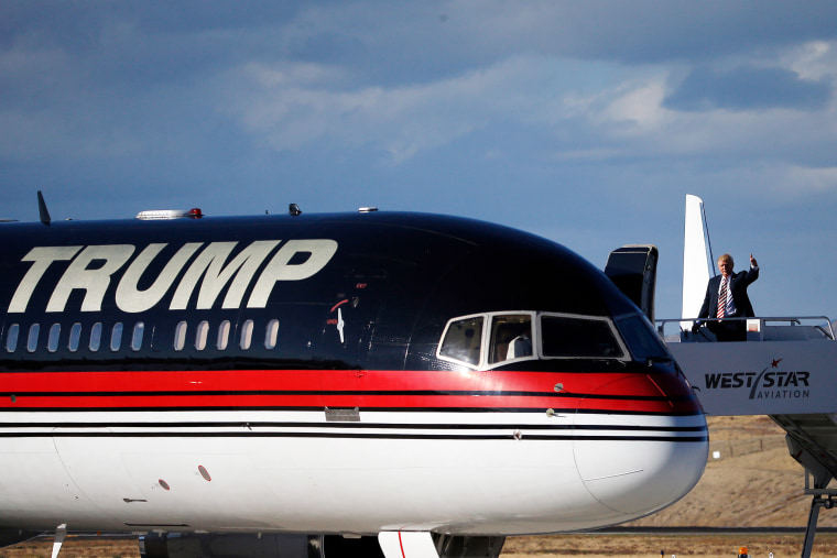 Donald Trump waves to supporters from his private plane during a campaign rally, in Grand Junction, Colo., in 2016.