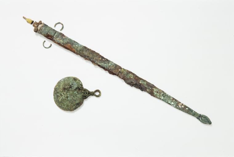 An Iron Age sword and mirror found at the Bryher burial site. 