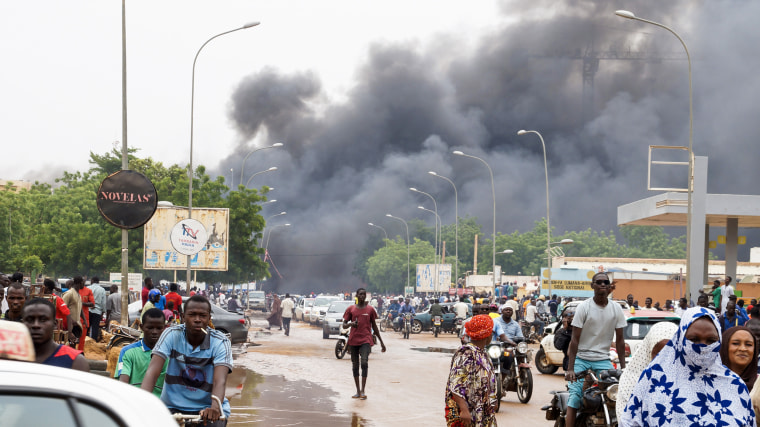 Smoke rises after coup supporters set fire to the headquarters of President Mohamed Bazoum's party, the Party for Democracy and Socialism in Niger in Niamey, Niger on July 27, 2023.