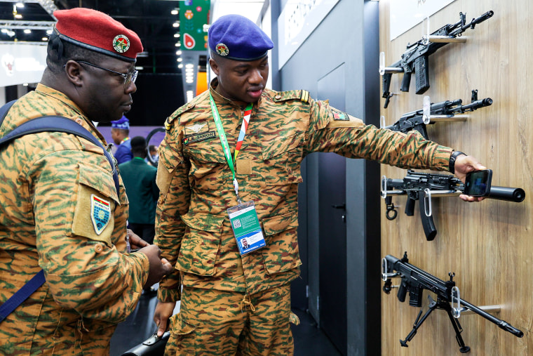 Members of delegations examine a weapon exhibition on the sideline of the Russia Africa Summit in St. Petersburg, on July 28, 2023.