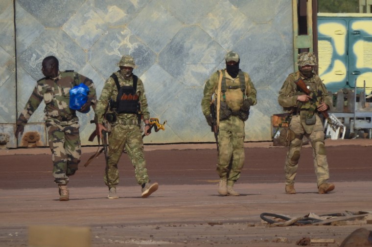Three Russian mercenaries, right, in northern Mali. 