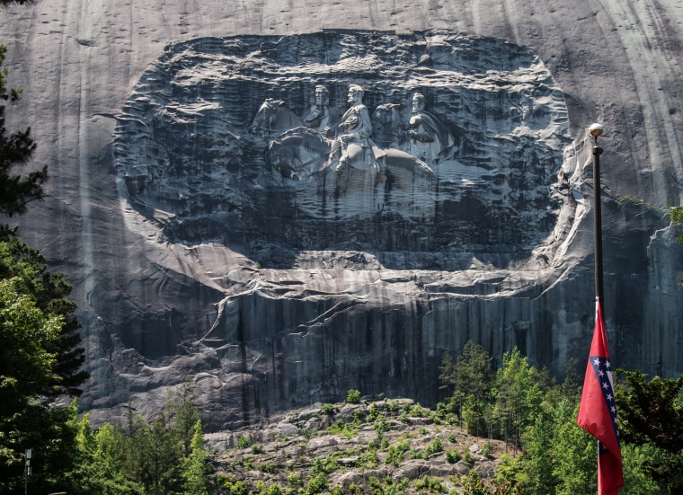 A carving on Stone Mountain in Georgia honors Confederate generals. 