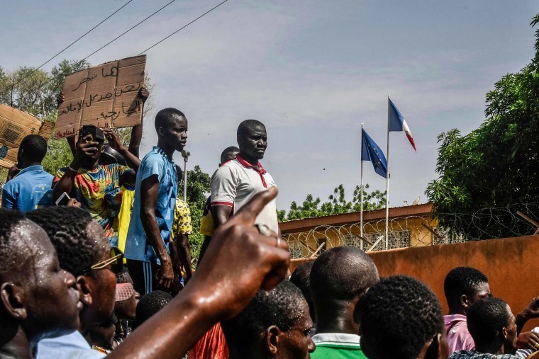 Protesters gather in front of the French Embassy in Niamey in support of Niger's junta on July 30, 2023.