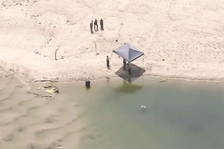 Deputies at the scene of a body discovered in a barrel in Malibu, Calif., Monday July 31, 2023.