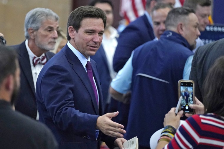 Florida Gov. Ron DeSantis shakes hands during a campaign event, Monday, July 31, 2023, in Rochester, N.H. 