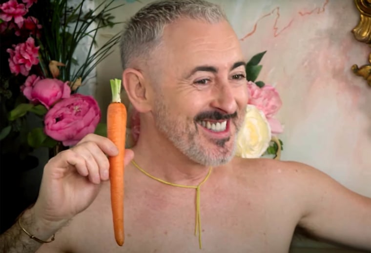 Alan Cumming is all smiles in his racy photo shoot.