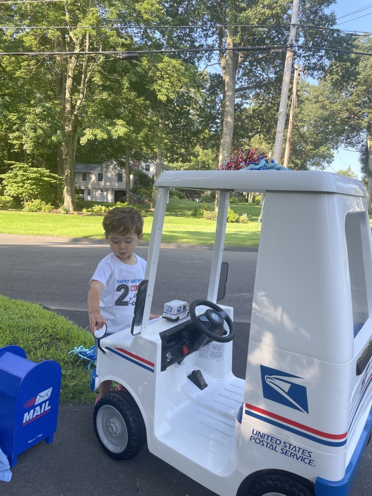 Colby and his mini mail truck.