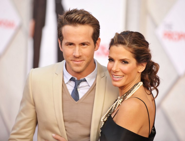 Actor Ryan Reynolds and actress Sandra Bullock arrive at the Los Angeles premiere of "The Proposal" at the El Capitan Theatre on June 1, 2009 in Hollywood, California.