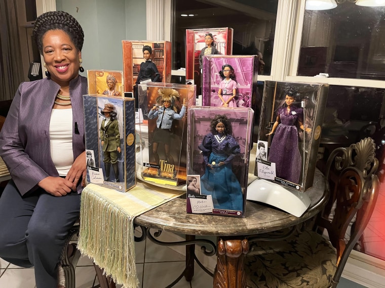 Elizabeth Wilson shows off her impressive Black Barbie doll collection.
