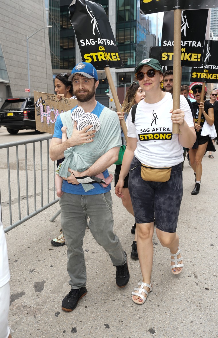 Daniel Radcliffe and Erin Darke join the picket line in New York City on July 21, 2023.