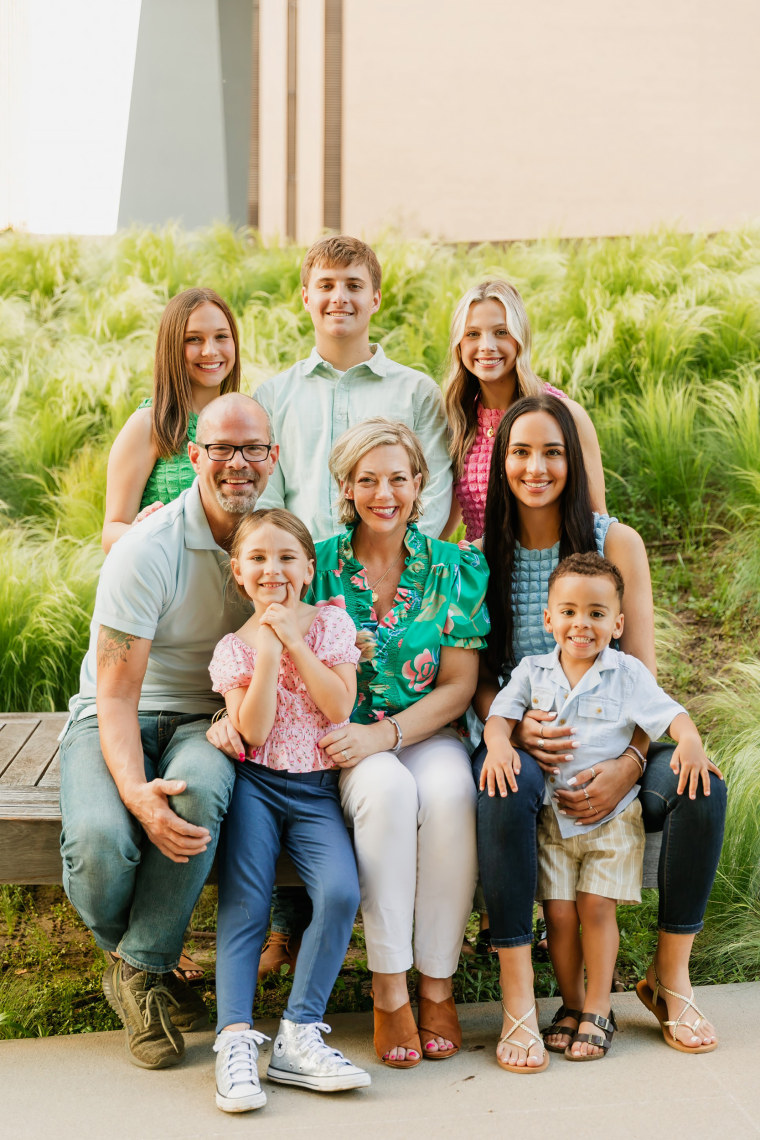 Jennifer McMillan, sitting center, is surrounded by her family. Her husband, Tony McMillan, and bonus daughter, Lillian McMillan, are sitting on the left. Daughter Peyton Washington and grandson Weston Blackburn are sitting on the right. Back row, from left to right, includes daughter Maggie Washington, son Thomas Washington and daughter Olivia Washington. 