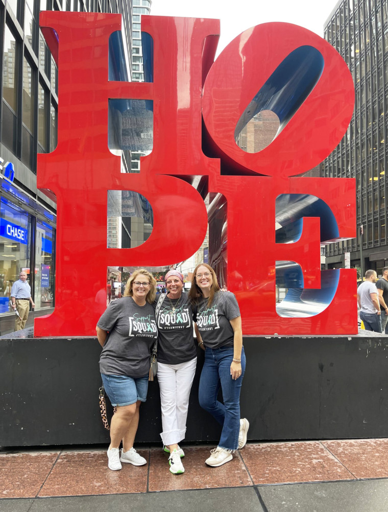  McMillan, center, poses with her sister, Michele Stapleton, left, and her sister, Emily Hart, right, in New York. 