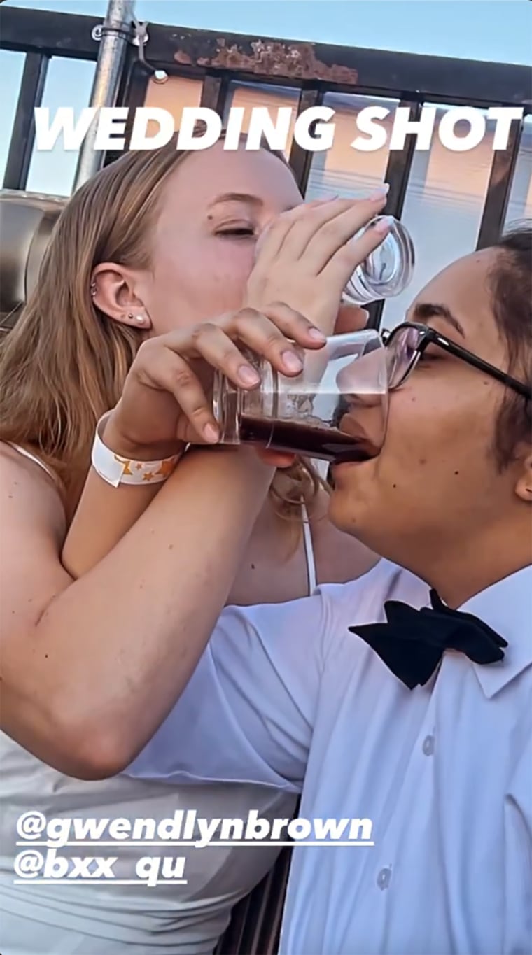 The happy couple shares a shot to celebrate!