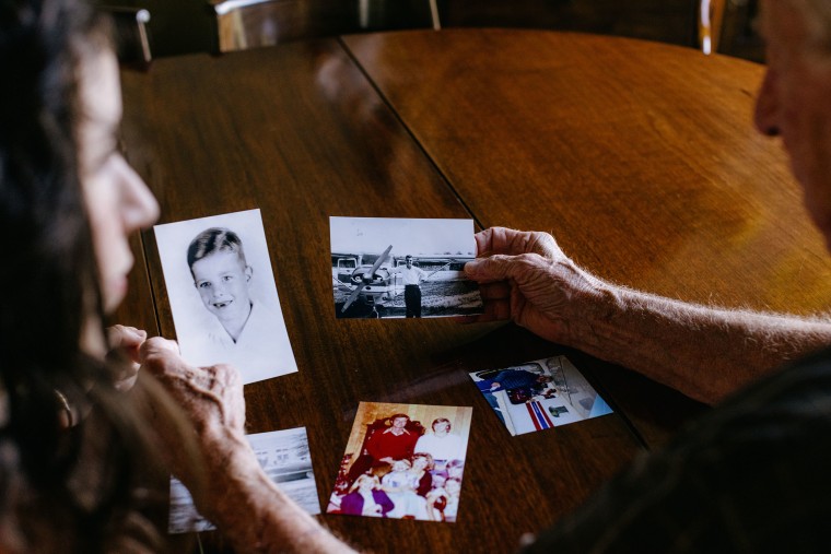 Fred Vollman and Olivia Savoie at the home of Mr. Vollman in Bunkie, La. looking over old family photographs. Olivia Savoie was commissioned to write the biography and family history for Mr. Vollman which turned into a friendship after the two bonded during the process.