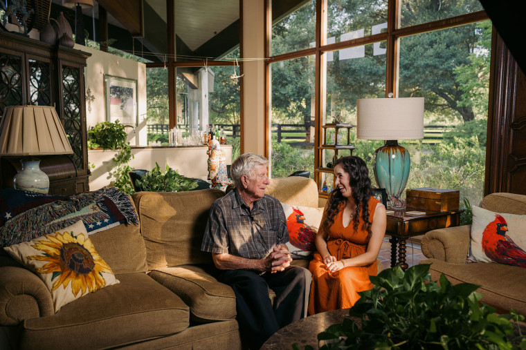 Olivia Savoie and Mr. Fred at his home in Bunkie, La. Mr. Fred's family hired Savoie to write his biography as a family keepsake.