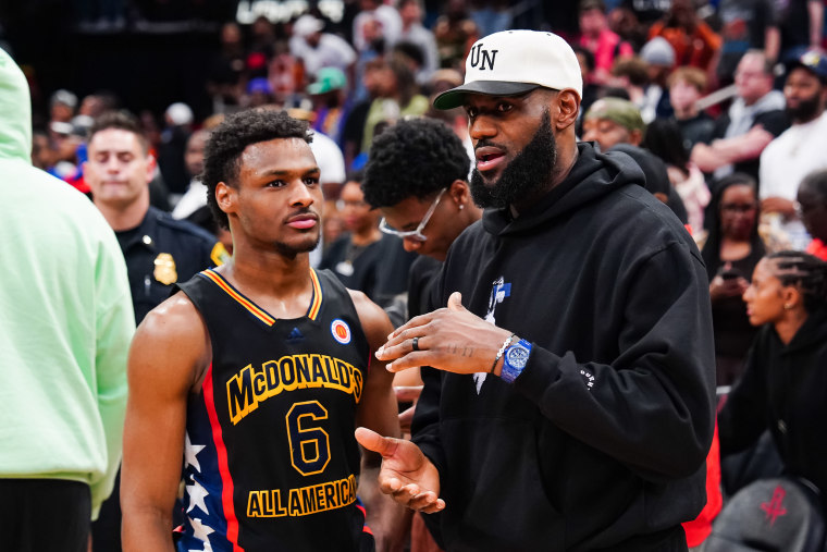 Bronny James and LeBron James after the 2023 McDonald's High School Boys All-American Game in Houston.