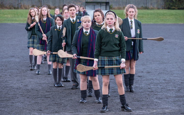 Saoirse-Monica Jackson as Erin, Nicola Coughlan as Clare, Dylan Llewellyn as James, Jamie-Lee O'Donnell as Michelle, Louisa as Harland Orla, and Leah O'Rourke
Jenny in "Derry Girls."
