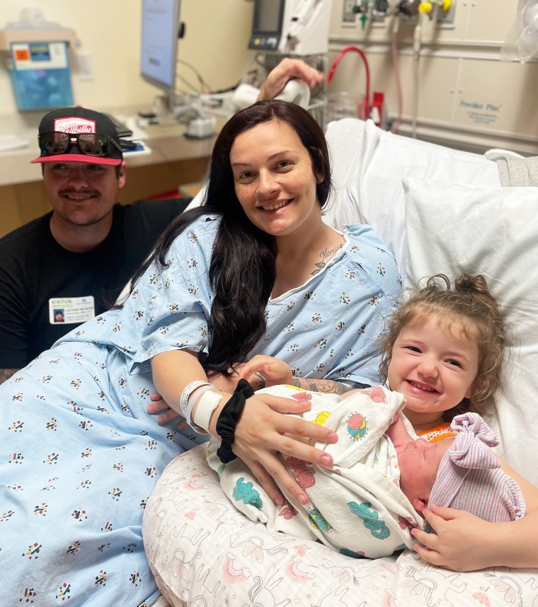 Family of four: Anthony and Shayanna Markham with their daughters Mariska and baby Harper.