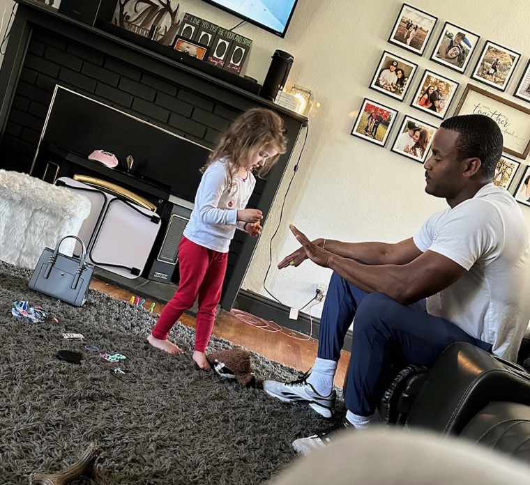 Will Parker, a firefighter and paramedic with the Vacaville Fire Department in California, gets a manicure by the daughter of a woman he assisted during an emergency birth.  