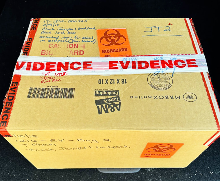 A photo of the box that contains Alex Schachter's backpack and lunch box. It's a biohazard because it has his blood on it and possibly bullet holes.