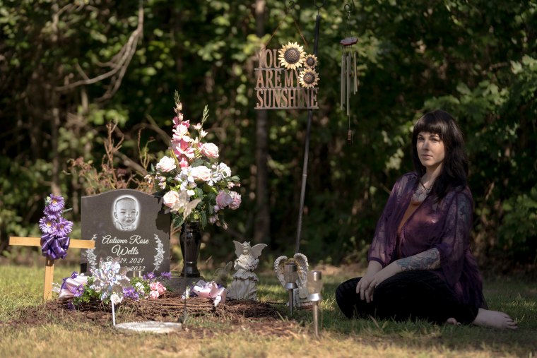 Autumn Wells' mother Taylor Wells at her daughter’s final resting place at the family cemetery plot in Belmont, Miss., on July 30, 2023.