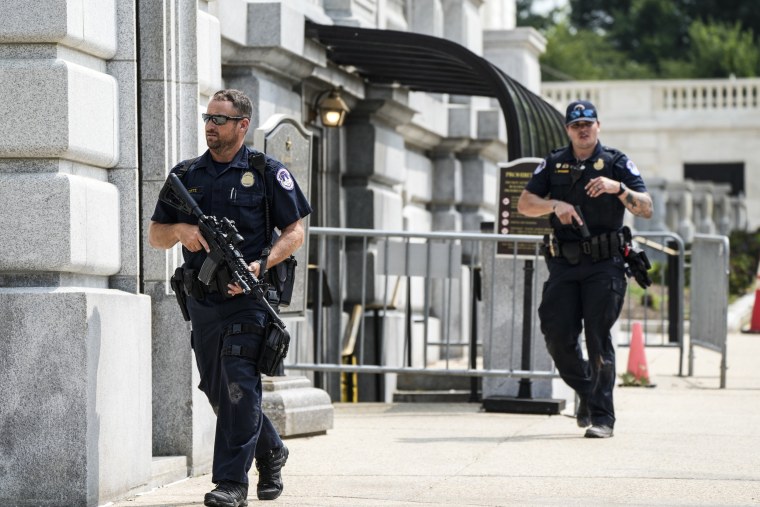 Image: U.S Capitol Police Officers patrol near the Russell Senate Office Building on Aug. 2, 2023.